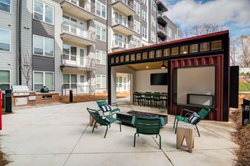 Outdoor bar with fireplace lounge